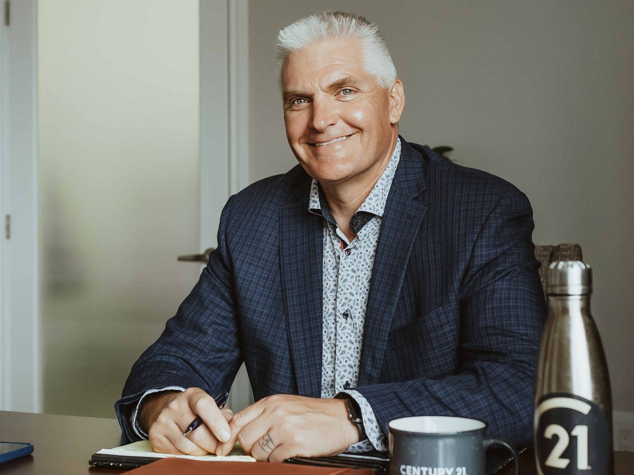 Patrick Galesloot, Broker/Owner of Century 21 Advantage, preparing real estate advice for Red Deer homeowners