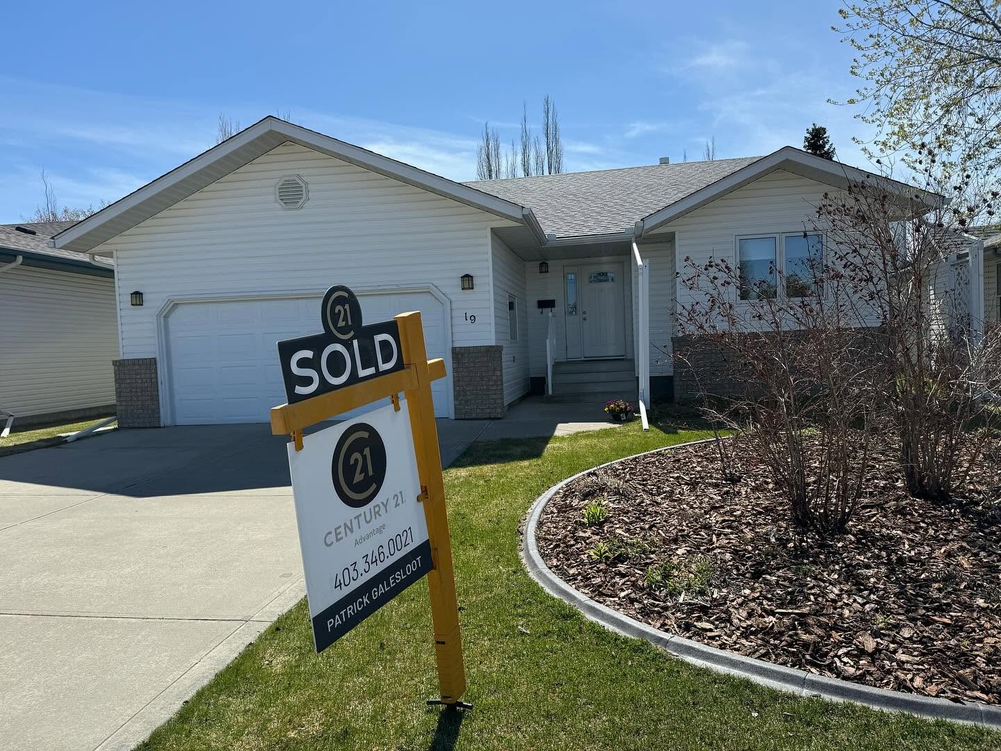 Century 21 Advantage sold sign outside a Red Deer home.